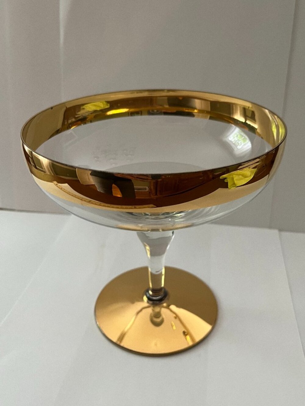 Vintage glass dish with thick gold rim and gold-plated footed base